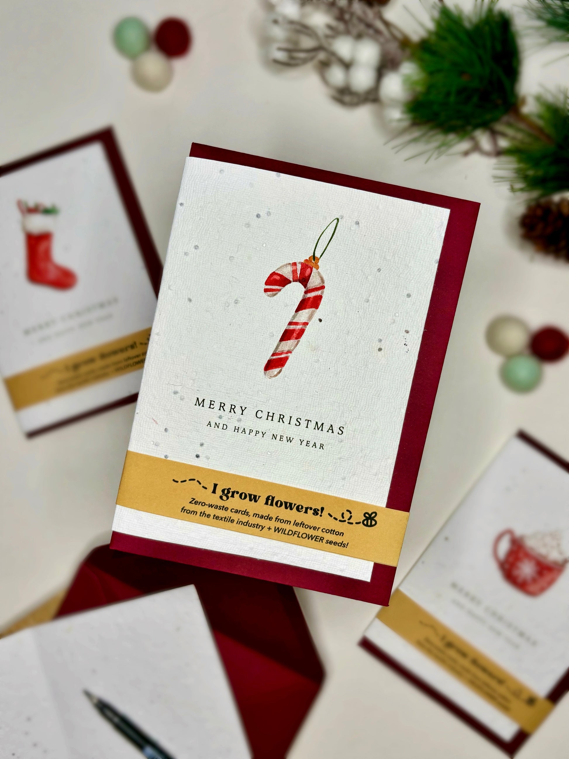 Watercolour candy cane bauble Christmas card on wildflower seeded paper, plantable Christmas card