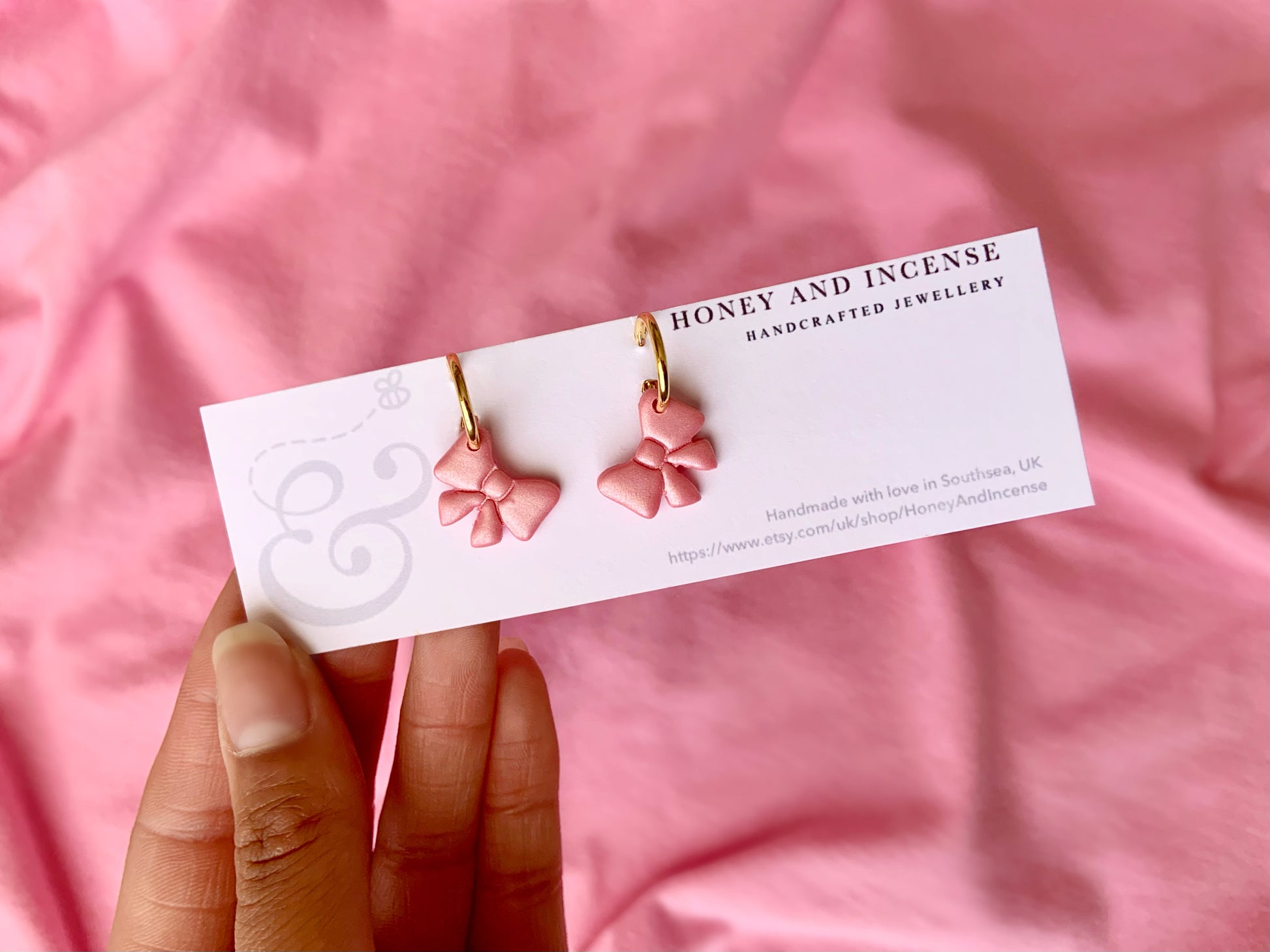 pale pink shimmery bows on gold huggie hoops
