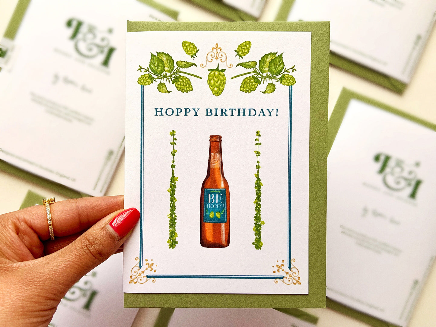 Beer Birthday card reading "hoppy birthday" and a bottle of beer with hops around it