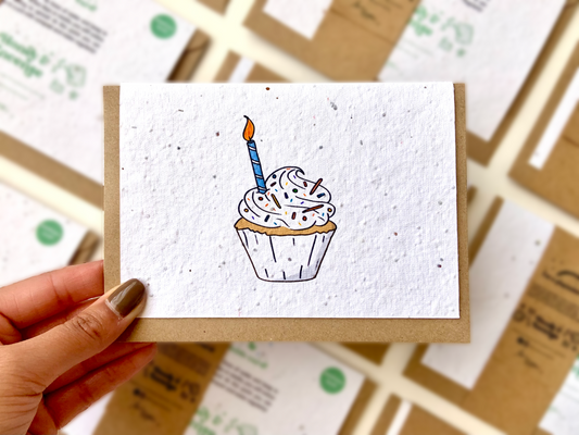 Plantable wildflower seed card with a cupcake with a candle in it.