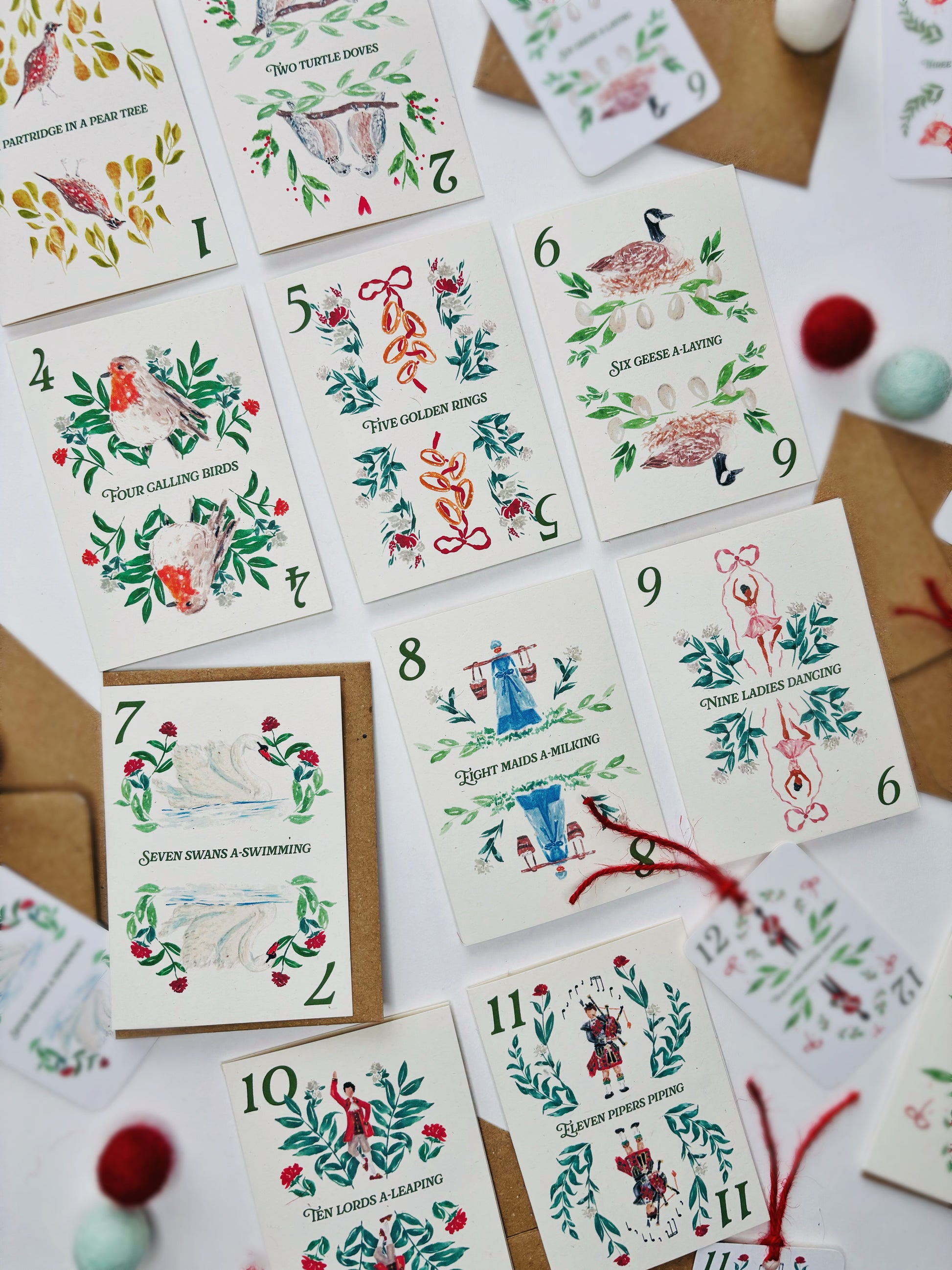 a range of 12 days of Christmas cards, each featuring hand painted depictions of each of the 12 gifts from the famous carol