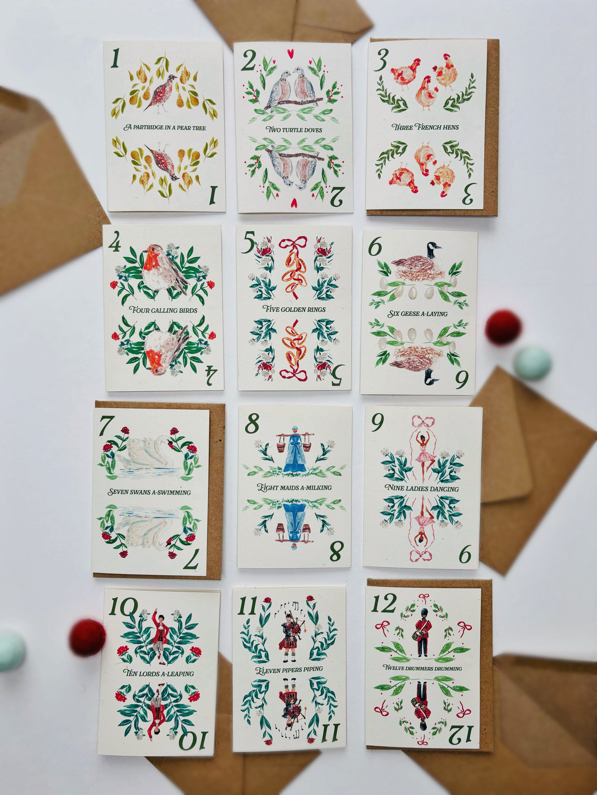 A range of recycled eco friendly mini 12 days of Christmas cards, each featuring hand painted depictions of each of the 12 gifts from the famous carol