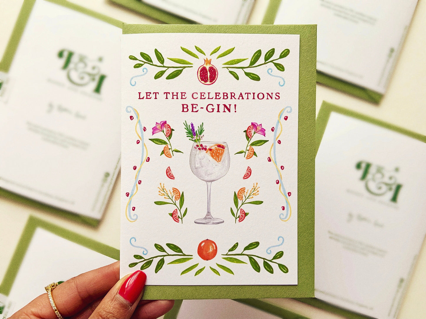 Gin pun greetings card, reads "Let the celebrations be-gin!"