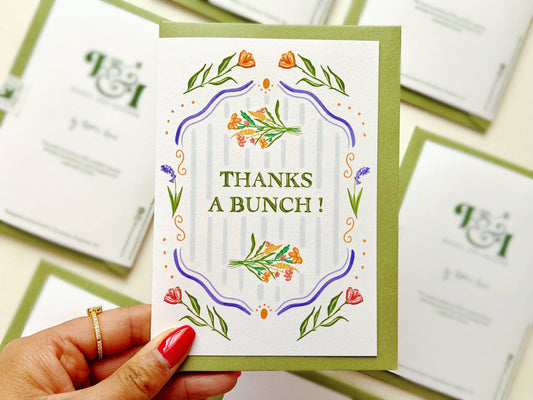 Thanks a bunch, eco friendly greetings card with a moss green envelope and floral designs.